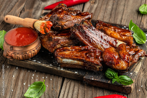 Delicious barbecued ribs seasoned with a spicy sauce, top view. place for text