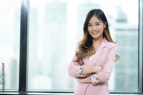 Happy confident smiling young professional Asian business woman corporate leader, Japanese female employee or company sales marketing manager standing arms crossed in office, cute girl portrait Free Download Happy confident smiling young professional Asian business woman corporate leader, Japanese female employee or company sales marketing manager standing arms crossed in office, cute girl portrait - GFXLoad