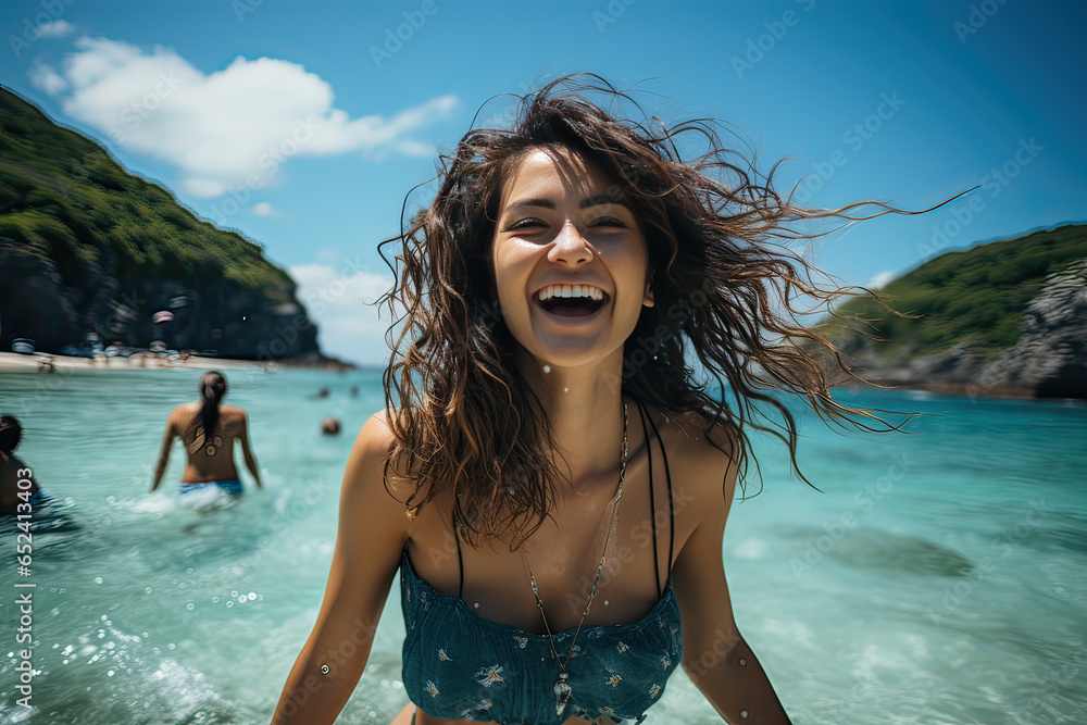 Asian woman happy relax and kicking seawater on the beach , blue sky abstract background at tropical beach.