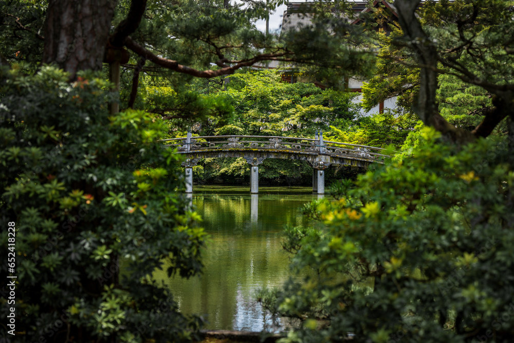 A beautiful bridge spanning a pond on the castle grounds in Kyoto, Japan.