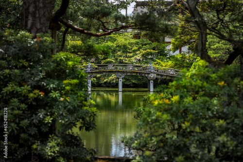A beautiful bridge spanning a pond on the castle grounds in Kyoto  Japan.