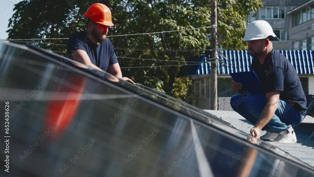 custom made wallpaper toronto digitalClose-up of two male engineers shaking hands, solar panels in the background. Deal and agreement for a business project in the field of industrial concept of renewable and green energy sources