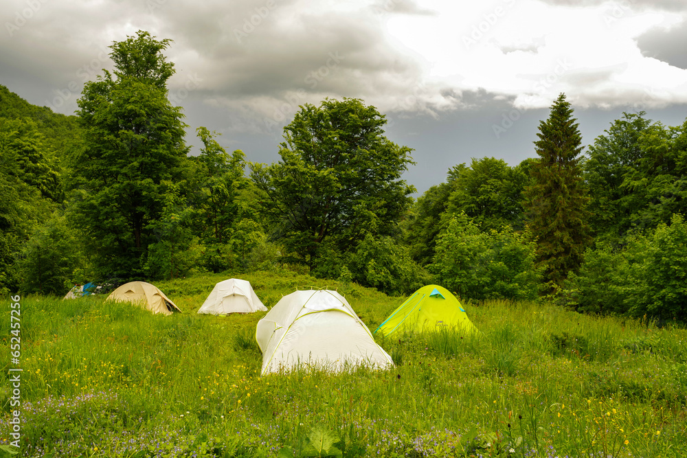Several tourist tents. Camping camp. Camping camp against the backdrop of nature.
