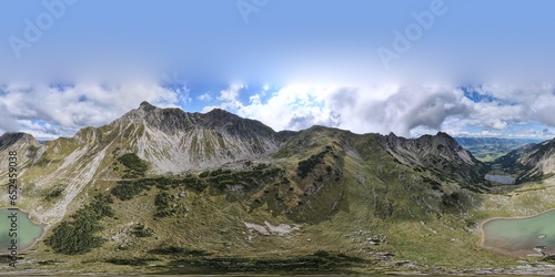 360 degrees panoramic view. Aerial view on the mountain lake high in the alpine mountains. Gaisalpsee, Bavaria. Germany