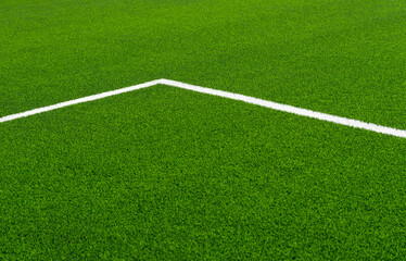 Green synthetic grass sports field with white line shot from above. Soccer, hurling, lacrosse, rugby, football, baseball sport concept