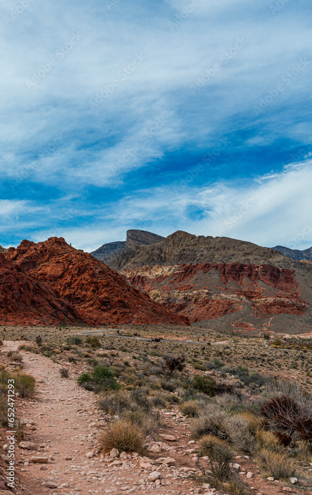 red rocks and mountains with a blue sky red rocks and mountains with a blue sky