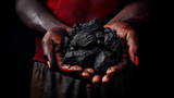 A dark-skinned miner holds a pile of coal in his hands, showing the viewer the result of his hard work.Generative AI