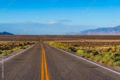 Desert Highway Road and Wind Turbines: Scenic Wheat Field Landscape in 4K
