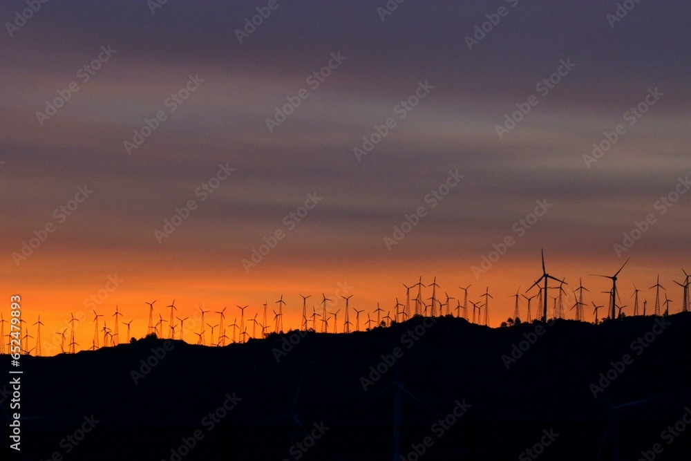 Mountain Wind Turbines at Dawn: Majestic Red Sunset Landscape in 4K Mountain Wind Turbines at Dawn: Majestic Red Sunset Landscape in 4K