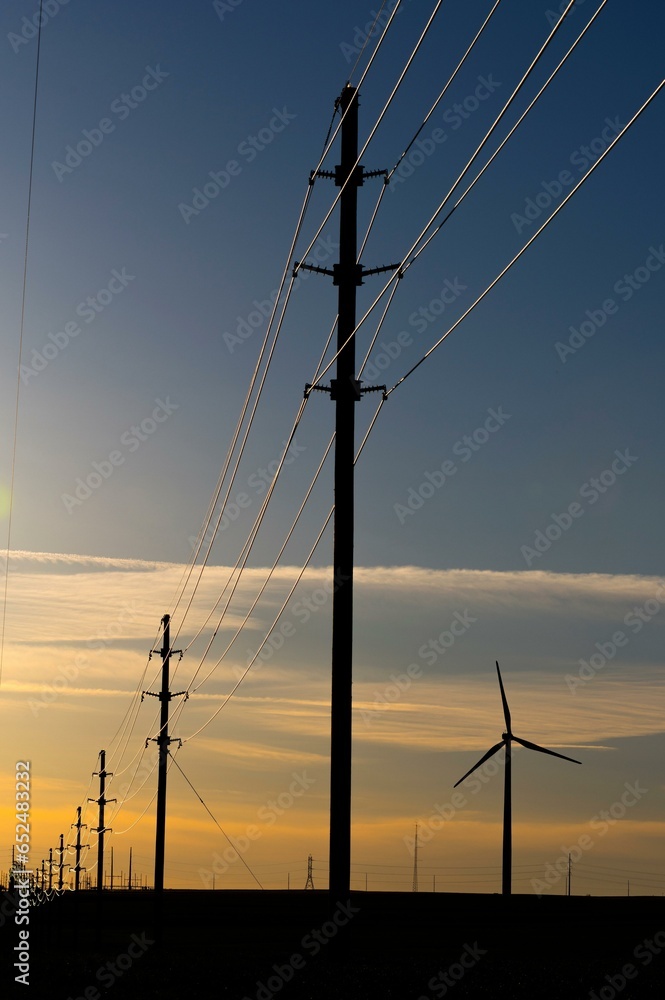 Wind Turbines on Wheat Field at Sunset with colorful sky 4K image