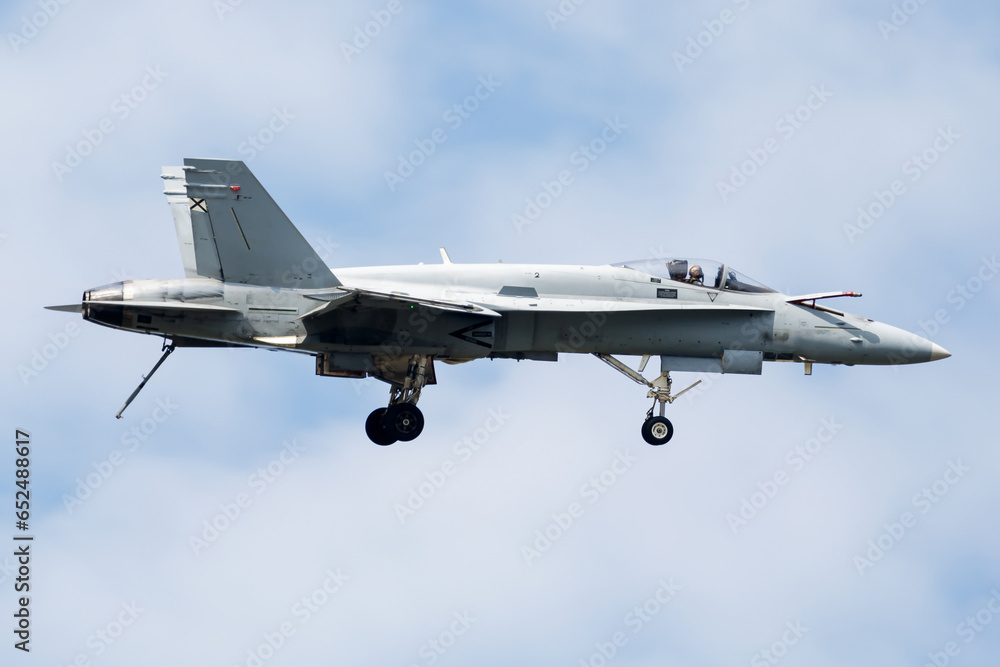 Obraz premium Military fighter jet plane at air base. Airport and airfield. Air force flight operation. Aviation and aircraft. Air defense. Military industry. Fly and flying.