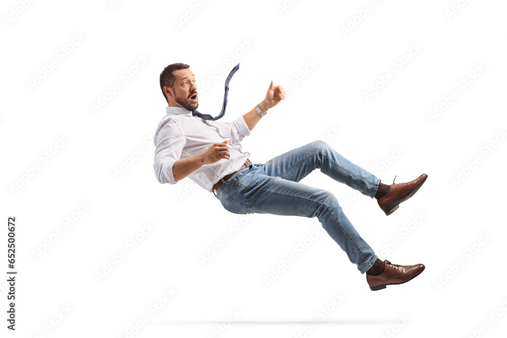 Foto Scared young businessman falling