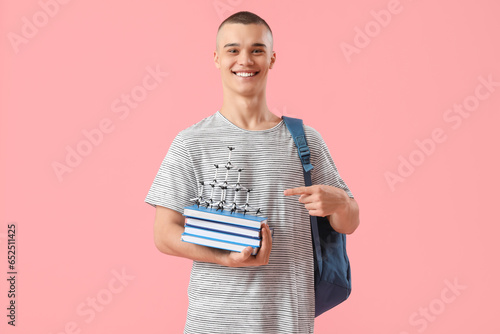 Happy male student with bac...