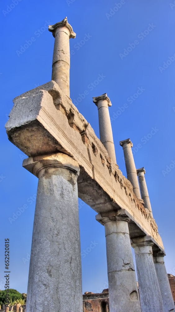 Pompeii Italy Roman Ruins Town Atmospheric Mount Vesuvius eruption ash pumice stone archeological dig history ancient Taken at Sunset Showing the Remains of Columns Against a Bright Blue Sky