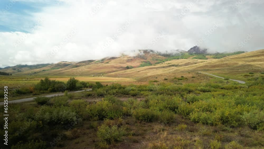 Aerial of horse pasture along Brush Creek Road in Crested Butte Colorado in fall in beautiful mountain valley Aerial of horse pasture along Brush Creek Road in Crested Butte Colorado in fall in beautiful mountain valley