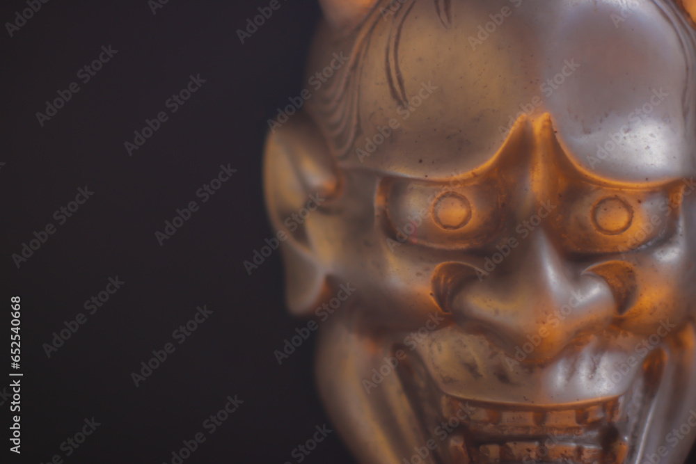 Traditional Japanese mask of a demon, Kabuki Mask on black background Traditional Japanese mask of a demon, Kabuki Mask on black background