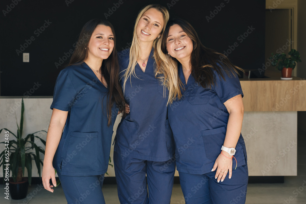 Fototapeta premium Beautiful smiling female health care workers looking at the camera.