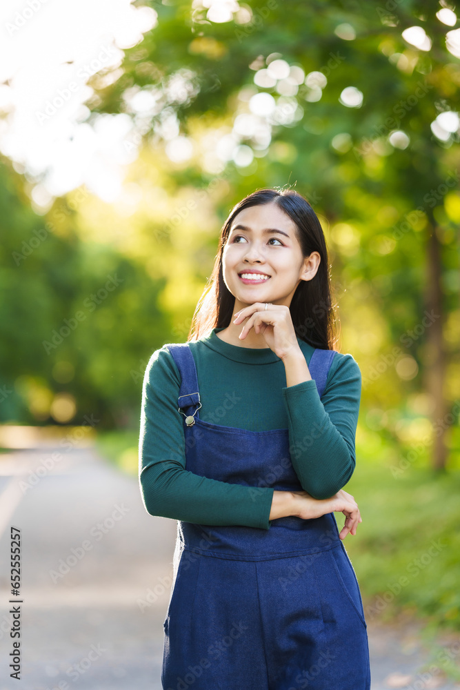 Happy young Asian woman people relaxing outdoors, Enjoy beauty of nature and find inner peace on a sunny afternoon, relax time, love your self. Happy young Asian woman people relaxing outdoors, Enjoy beauty of nature and find inner peace on a sunny afternoon, relax time, love your self.