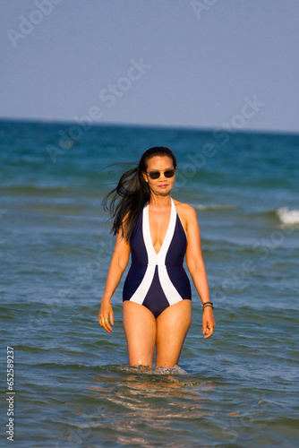 Woman body beautiful with bikini relax on beach
