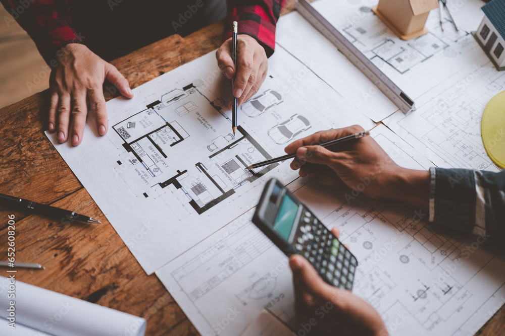 Structural engineer team discussing and calculating work Office design of the building structure concept of the construction project. building model meeting concept business objects Structural engineer team discussing and calculating work Office design of the building structure concept of the construction project. building model meeting concept business objects