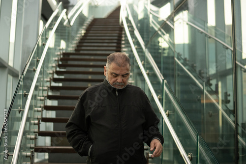 Slika na platnu Group of Men Standing on Staircase Railing in Architecture Building