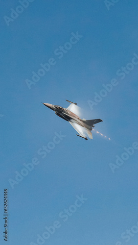  Fighter jet flying in the blue clear sky demonstrating skills_7