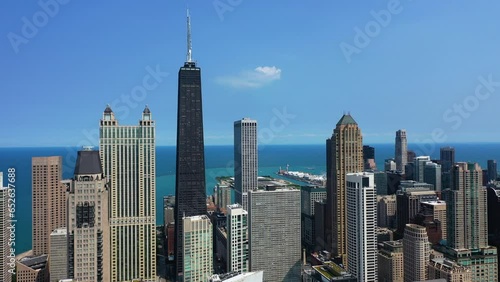 Streeterville skyline in sunny Chicago, Illinois, USA - Ascending, aerial view photo