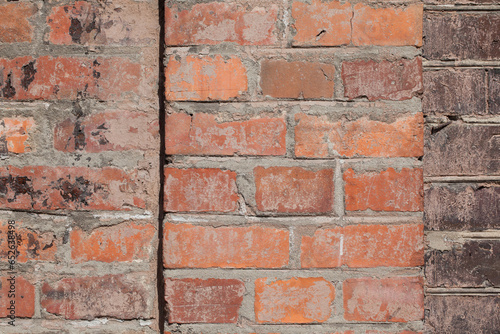 Brick wall, texture, background. Uneven, nonuniform surface. photo