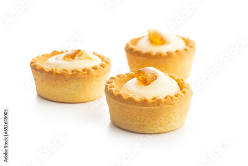 Sweet tarlets. Tasty mini tarts. Mini pie with cream isolated on white background. photo