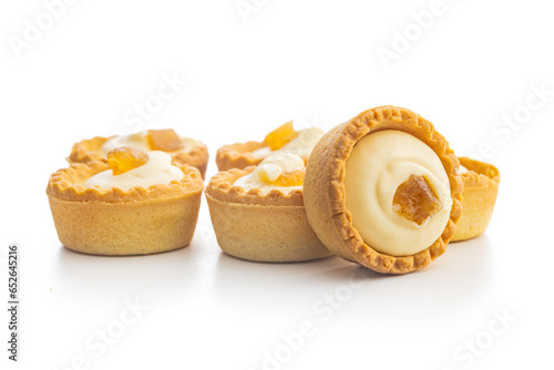 Sweet tarlets. Tasty mini tarts. Mini pie with cream isolated on white background. photo