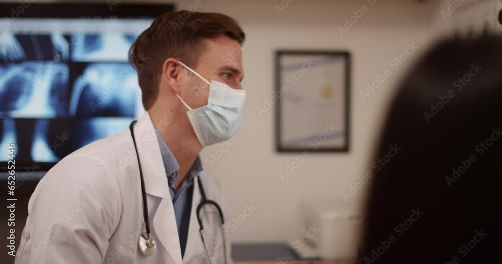 Patient in a checkup with a doctor. Dedicated doctor showing patient their results. GP talking to a patient Patient in a checkup with a doctor. Dedicated doctor showing patient their results. GP talking to a patient