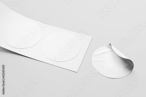 a set of round circular promotional sticker label tag with roll placed on surface realistic mockup template 3d rendering illustration photo