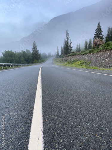 road in the mountains in the fog, photo as a background, digital image