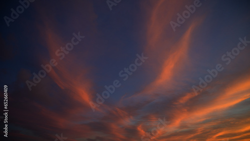 Sunset sky with orange clouds. Nature background.
