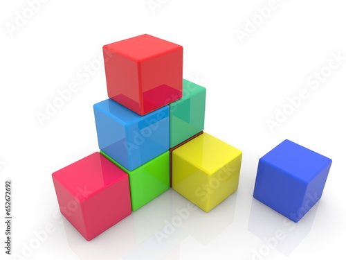 An abstract  unfinished pyramid of colorful toy cubes