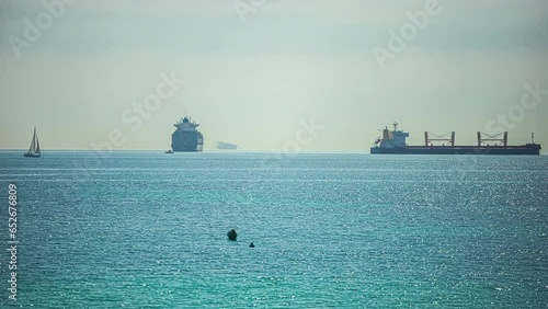 Ships, sailboats, cargo vessels, and ferries in the Port of Gibraltar, Spain - time lapse photo