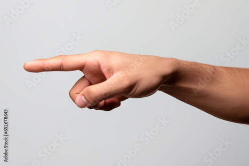 Studio photography of caucasian male hand performing point gesture