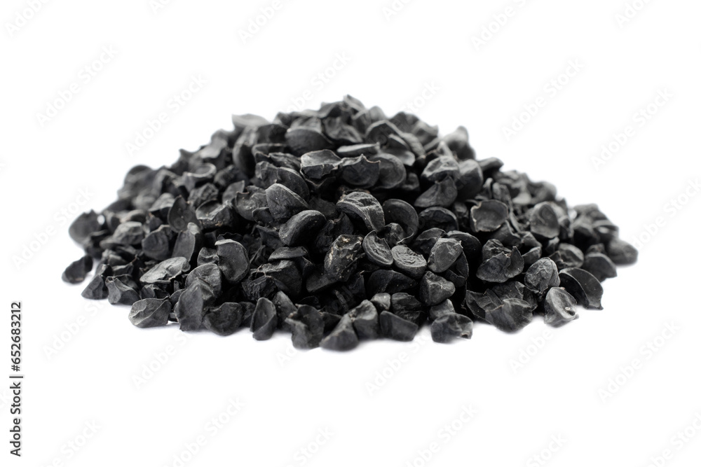Heap of black onion seeds isolated on white background, top view. Photo of black onion seeds to create the perfect package with the seeds in the background. Black onion seed, nigella or kalonji. - obrazy, fototapety, plakaty 