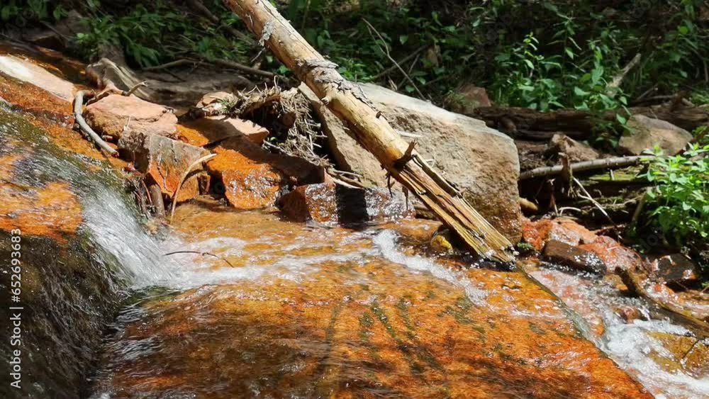 Close up view of a small water fall in a stream located in the Rocky Mountains of Colorado at Staunton State Park Close up view of a small water fall in a stream located in the Rocky Mountains of Colorado at Staunton State Park