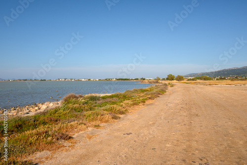 Gravel road along Tigaki salt lake  Alykes  on the island of Kos. Greece