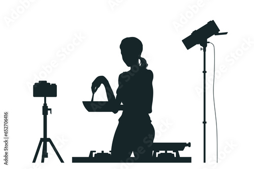 Food blogger silhouette. Woman streaming cook video on camera. Culinary vlog scene. Chef home broadcast. Healthy eating show