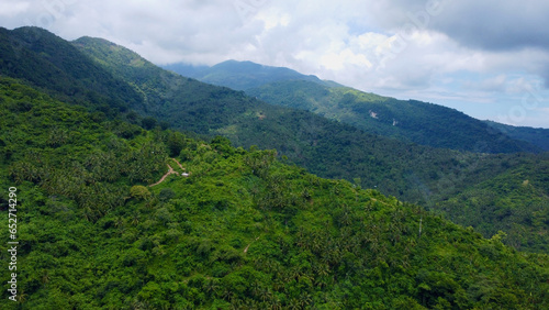 Landscape in the mountains. Cloudiness in the mountains. Fog in the mountains. Mountain tops covered with jungle and tropical rainforest among the clouds.