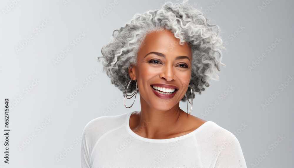 Elegant mature black woman with a joyful smile, smooth complexion, and long gray hair, ideal for beauty and cosmetics advertising, isolated on white,banner
