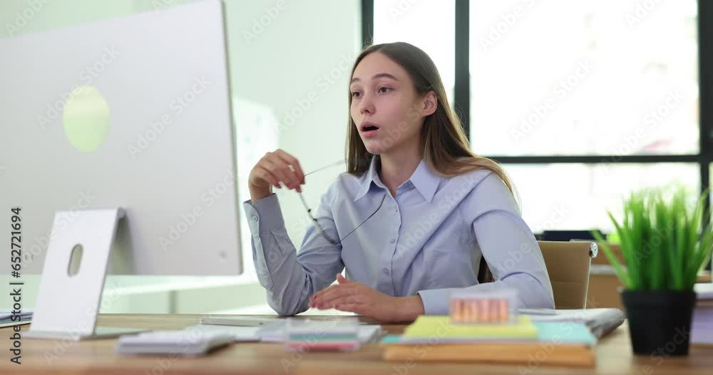 Shocked freelancer girl looking at computer takes off glasses surprised by bad news. Frustrated student intern having problems with application and software errors occurring and feeling panic Shocked freelancer girl looking at computer takes off glasses surprised by bad news. Frustrated student intern having problems with application and software errors occurring and feeling panic