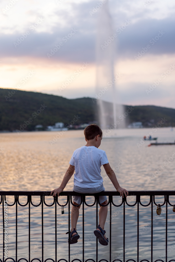 child admiring the picturesque sunset, travel and active recreation