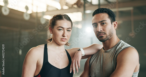 Fitness, friends and face in gym with confidence, workout and exercise class. Diversity, young people and wellness portrait of serious athlete with coach ready for training and sport at a health club