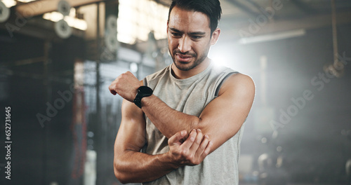 Photography Arm pain, fitness and asian man at gym for training with joint problem, discomfort or arthritis