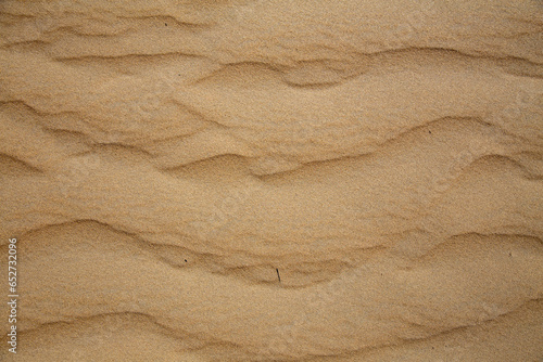 Naturally beautiful lines created by the wind in the desert sand photo