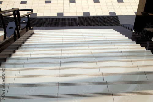 The composition of a footbridge on a sunny day can be used as a background article photo