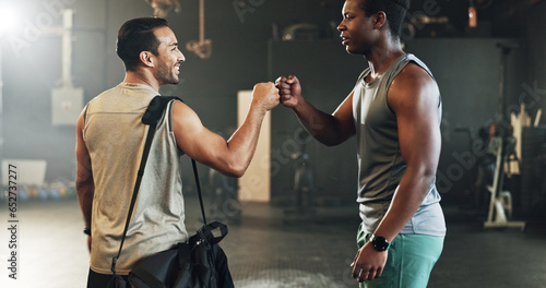 Teamwork, friends and fist bump with people in gym for motivation, support and workout. Personal trainer, health and exercise with men in fitness center for training, wellness or performance together